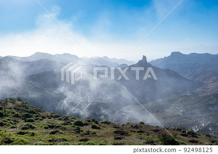 Foggy view of Roque Bentayga from Mirador de Degollada Becerra Gran Canaria, Canary Island, Spain Foggy view of Roque Bentayga from Mirador de Degollada Becerra Gran Canaria, Canary Island, Spain 92498125