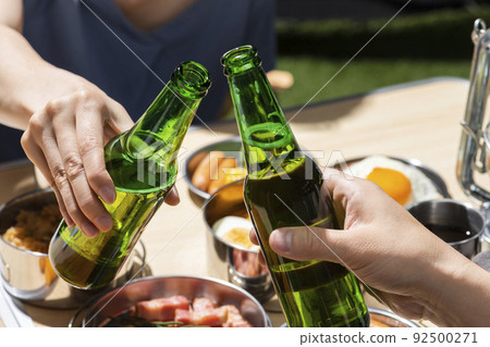 Drink beer at a summer outdoor camp 92500271
