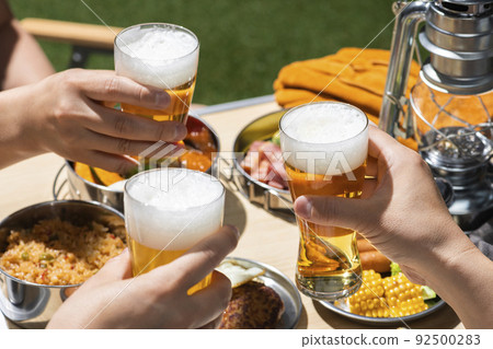Drink beer at a summer outdoor camp 92500283