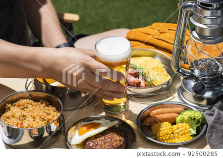 Drink beer at a summer outdoor camp 92500285