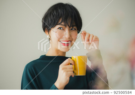 A woman in a dark green knit 92500584