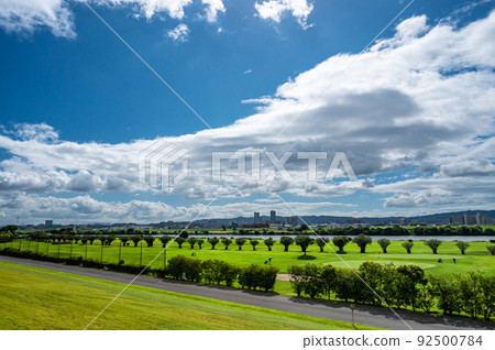 A golf course on the riverbed and clouds in the sky 92500784