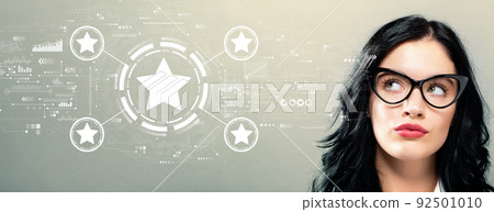 Rating star concept with young businesswoman 92501010