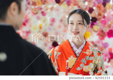 Bride and groom with red furisode Bride and groom with red furisode 92501315