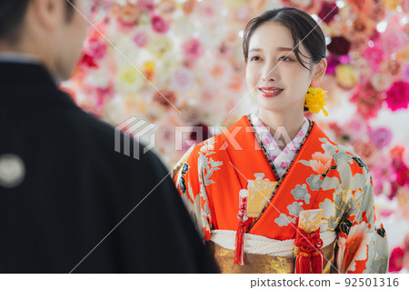 Bride and groom with red furisode Bride and groom with red furisode 92501316