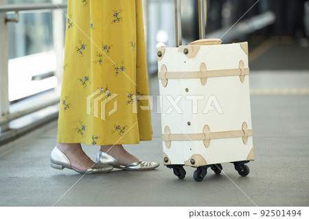 Airport passage, sidewalk, female feet 92501494