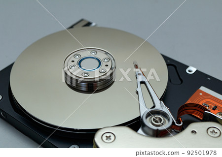 Disassembled hard disk platter and magnetic head Disassembled hard disk platter and magnetic head 92501978