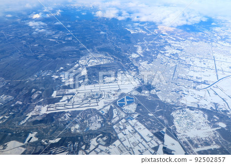 Aerial view from a passenger plane heading for Asahikawa in winter and view of Asahikawa Airport 92502857
