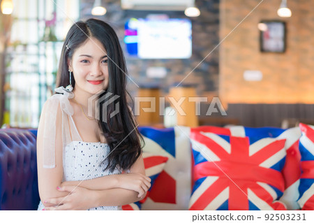 Portrait of woman smiling at vintage restaurant cafe 92503231
