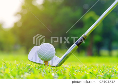 Golf ball on green grass ready to be struck on golf course 92503232