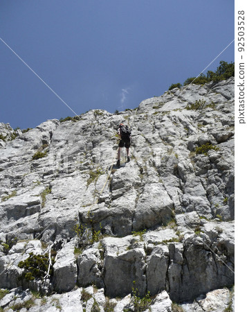 Climber at Ruchenkopfe mountains in Bavaria, Germany Climber at Ruchenkopfe mountains in Bavaria, Germany 92503528