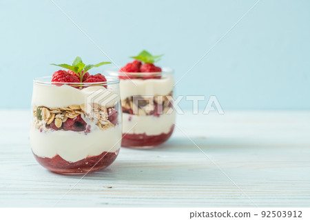 fresh raspberry and yogurt with granola 92503912