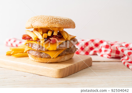 pork burger with cheese, bacon and french fries pork burger with cheese, bacon and french fries 92504042