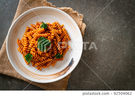 spirali or spiral pasta with tomato sauce spirali or spiral pasta with tomato sauce 92504062