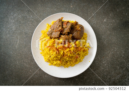 Beef Biryani or Curried rice and beef - Thai-Muslim version of Indian biryani, with fragrant yellow rice and beef 92504312