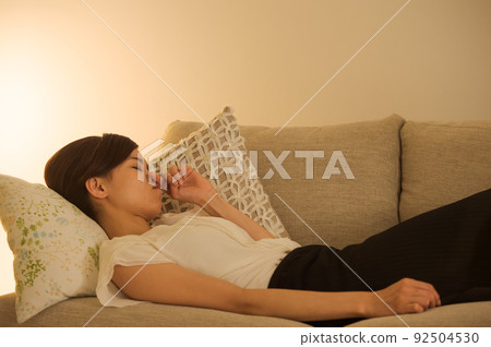 Woman sleeping tired on the sofa 92504530