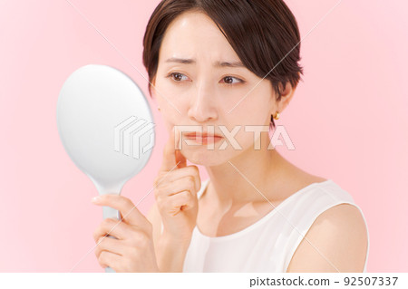 Women suffering from skin trouble Women suffering from skin trouble 92507337