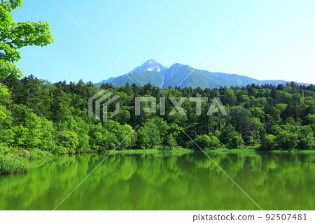 Early summer Himenuma Mt. Rishiri with residual snow 92507481