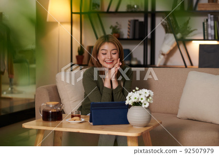 Woman Having Tea with Cookies Woman Having Tea with Cookies 92507979