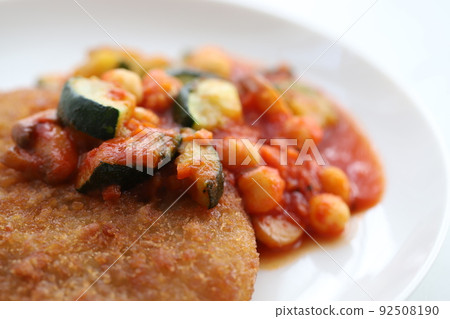 Pork cutlet with chunky vegetables and tomato sauce 92508190