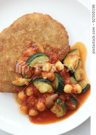 Pork cutlet with chunky vegetables and tomato sauce Pork cutlet with chunky vegetables and tomato sauce 92508196
