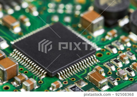 Close-up of computer chip on a part of electronic printed circuit board 92508368
