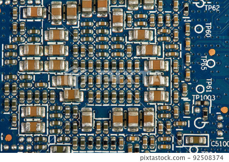 Resistors, capacitors, transistors on an electronic computer printed circuit board 92508374