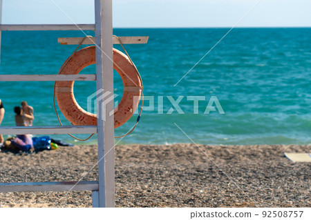 Old preserver beach life Crimea saver protection equipment buoy sos, from lifebuoy help for ocean from lifesaver summer, guard background. Travel sunrise round, 92508757