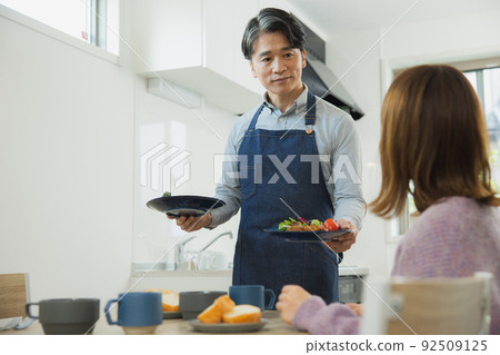 Middle man carrying food Middle man carrying food 92509125