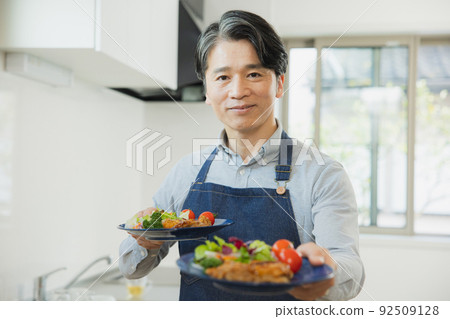 Middle man carrying food Middle man carrying food 92509128