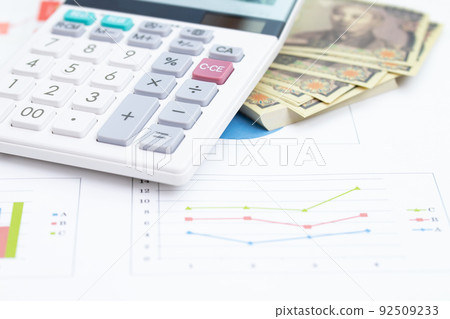 Graph and analyze the status of investment and financial reports. Investment and finance consultant concept. Graph and analyze the status of investment and financial reports. Investment and finance consultant concept. 92509233