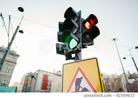 Temporary traffic control lights and triangle building site traffic sign Temporary traffic control lights and triangle building site traffic sign 92509633