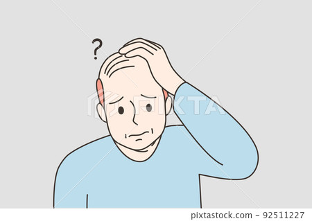 Unhappy man suffer from alopecia 92511227
