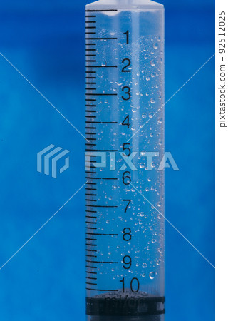 Medicine, Injection, vaccine and disposable syringe isolated, drug concept. Sterile vial medical. Macro close up on backgrounds gray. 92512025