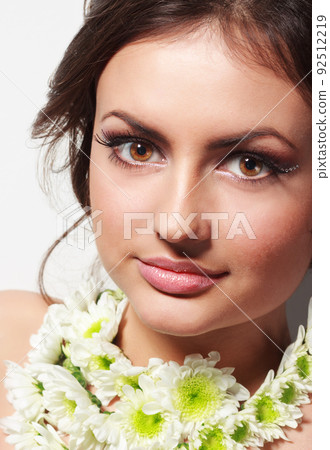 Closeup portrait of young beautiful woman with a healthy clean skin - isolated on white background. Closeup portrait of young beautiful woman with a healthy clean skin - isolated on white background. 92512219