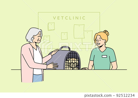 Old woman bring pet to vet clinic Old woman bring pet to vet clinic 92512234
