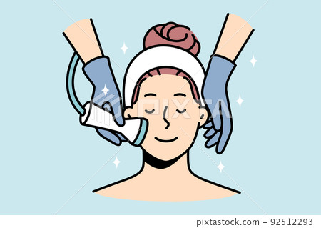 Woman enjoy face care treatment in salon 92512293