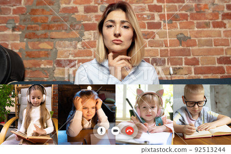 Group of different kids studying online by group video call, use video conference with each other and teacher. PC screen view with application ad. 92513244