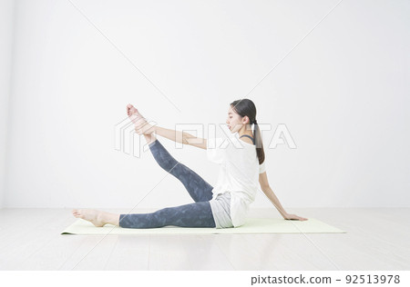 Woman stretching in the living room Woman stretching in the living room 92513978