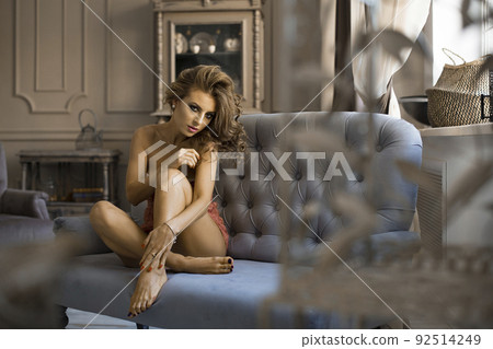 picture of lovely blonde in lingerie sitting on the sofa picture of lovely blonde in lingerie sitting on the sofa 92514249