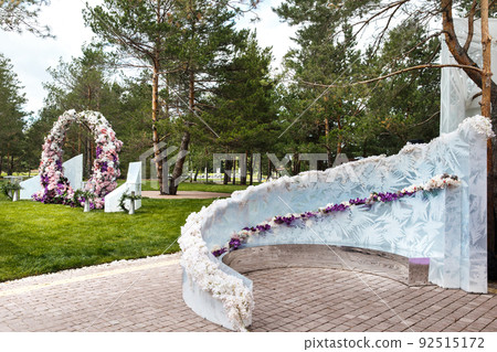 Outdoor wedding ceremony with umbrellas in the forest Outdoor wedding ceremony with umbrellas in the forest 92515172