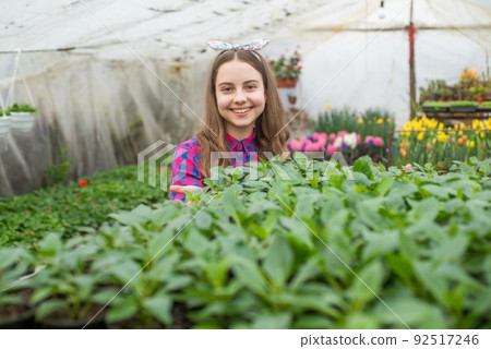 green life. planting pot plants. child gardener. flowers in garden. daily chores. green life. planting pot plants. child gardener. flowers in garden. daily chores. 92517246