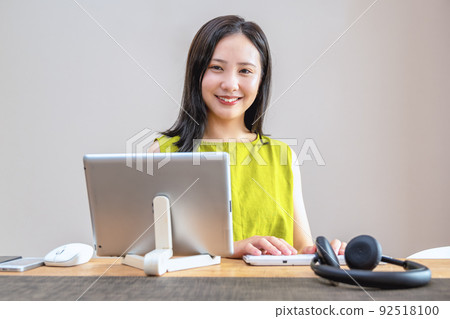 Young woman working at home Young woman working at home 92518100