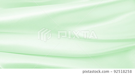 Smooth elegant green silk or satin luxury cloth texture as abstract background. Luxurious background design Smooth elegant green silk or satin luxury cloth texture as abstract background. Luxurious background design 92518258