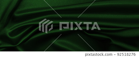 Smooth elegant green silk or satin luxury cloth texture as abstract background. Luxurious background design Smooth elegant green silk or satin luxury cloth texture as abstract background. Luxurious background design 92518276