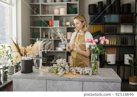 Small business. Female florist in flower shop. 92518640