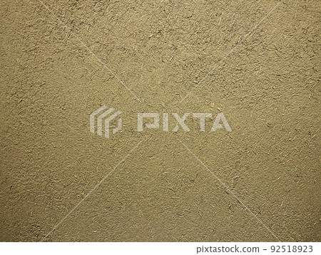 沙色粘土牆中稻草粗糙紋理殘留的表面水平背景圖像 92518923
