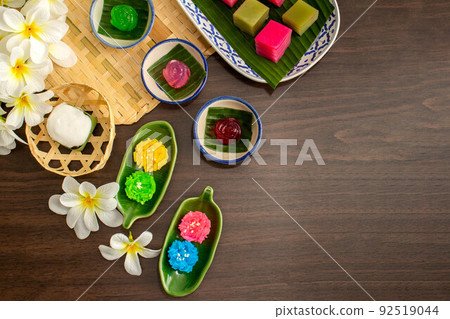 Thai dessert concept, Thai pudding with coconut topping glossy sticky rice and layered desserts 92519044