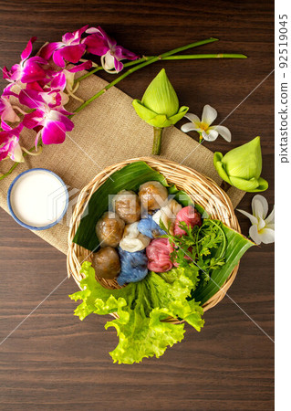 Thai dessert concept, Thai coconut milk custard and tapioca balls with pork filling on basket 92519045