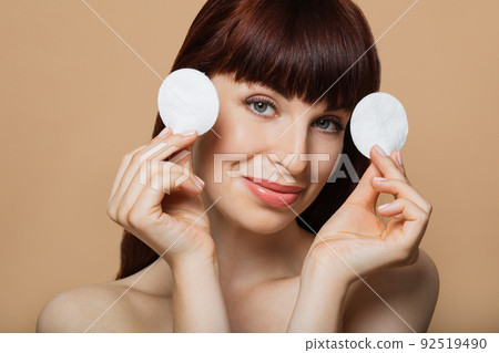 Close-up portrait of nude positive red-haired girl with shiny pure clean fresh smooth flawless skin 92519490